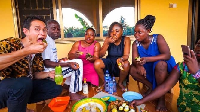 Friends laughing while eating together
