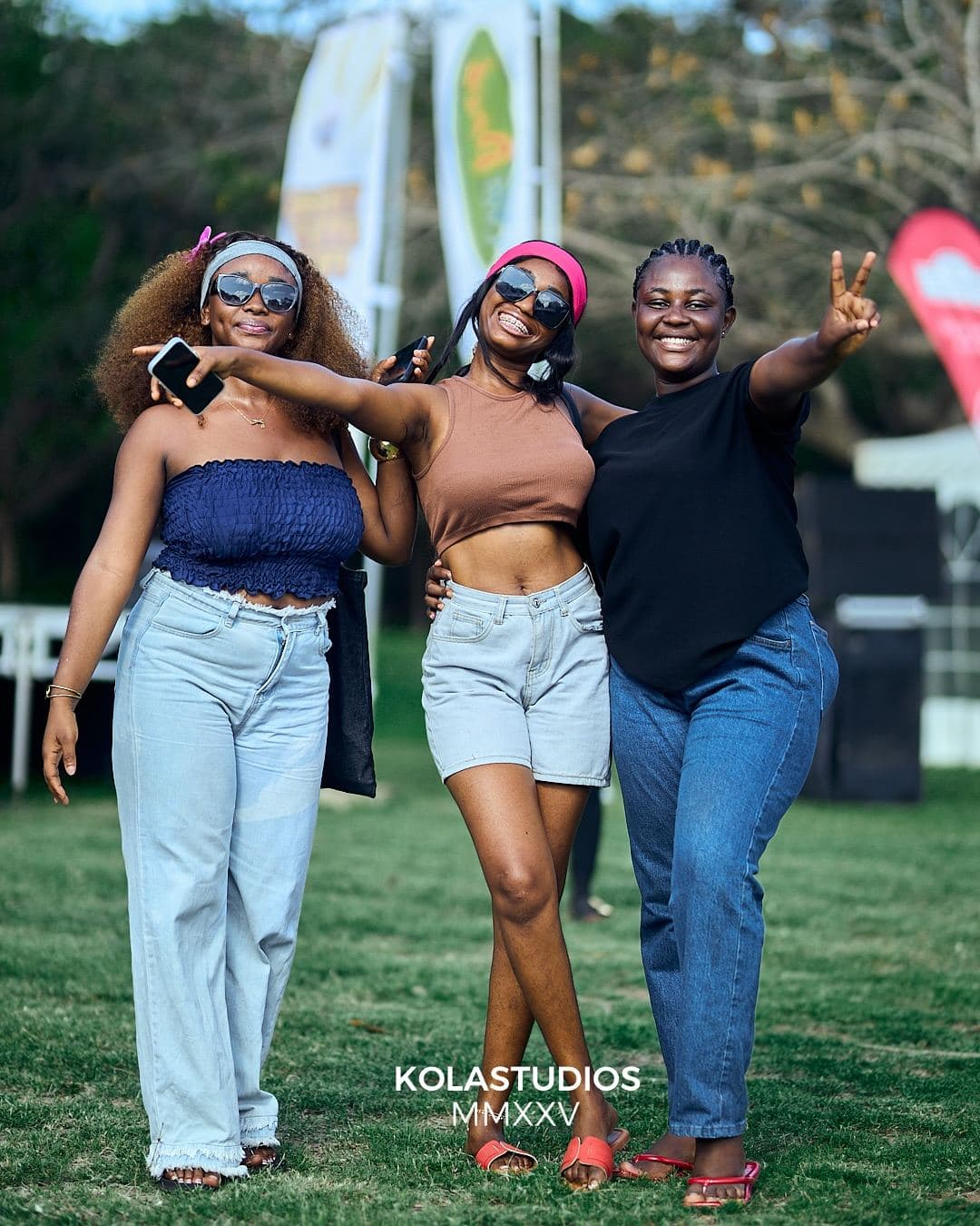 Friends posing on the grass at the feast